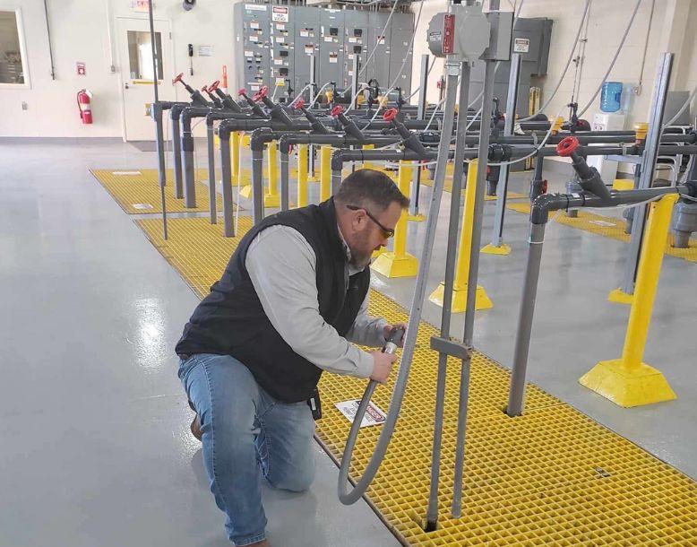 Veolia team member inspects equipment